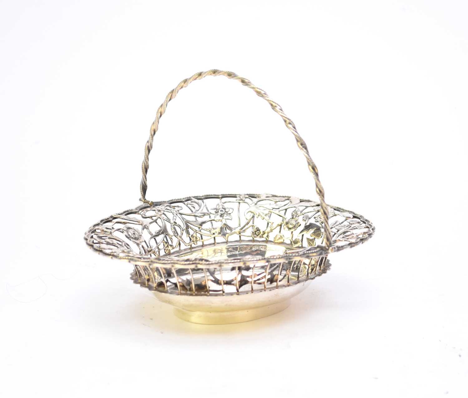 Lot 75 - An Edwardian silver swing handled basket by William Comnys