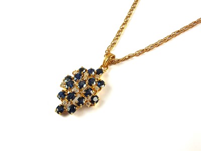 Lot 75 - A sapphire and diamond cluster pendant