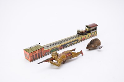 Lot 553 - An Einfalt clockwork tinplate toy soldier, Arnold train and Schuco mouse