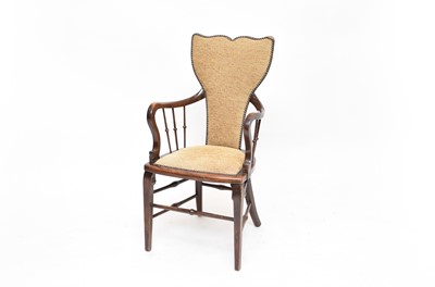 Lot 672 - An early 20th century mahogany elbow chair