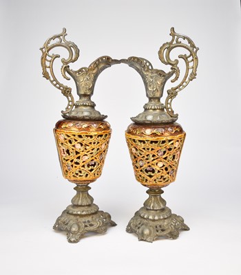 Lot 448 - A pair of Rococo style cast pierced and enamelled spelter ewers