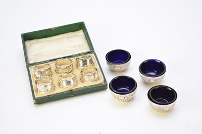 Lot 15 - A cased set of silver napkin rings and four silver salts