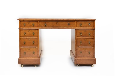 Lot 673 - A 20th century oak pedestal desk
