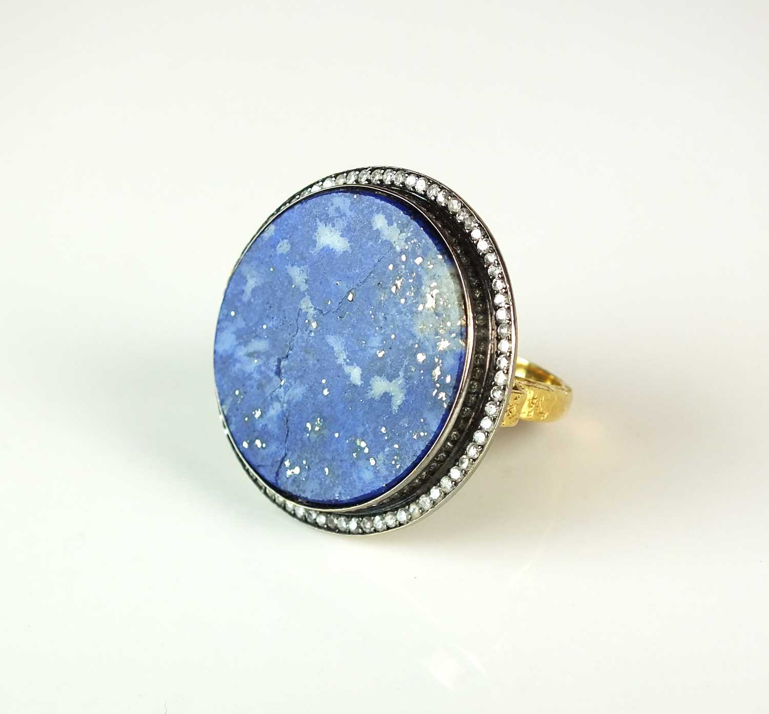 Lot 53 - An Egyptian lapis lazuli and diamond ring