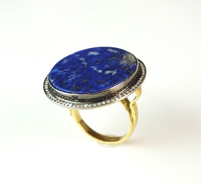 Lot 53 - An Egyptian lapis lazuli and diamond ring