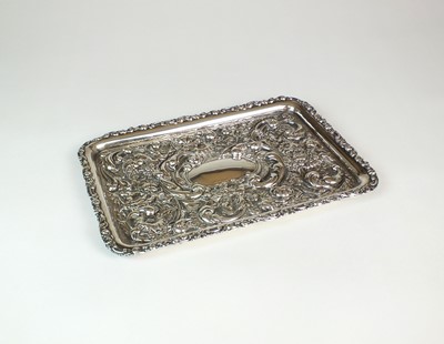 Lot 1 - An Edwardian silver dressing table tray