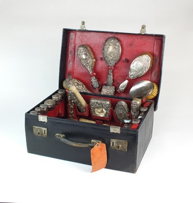 Lot 22 - A harlequin silver mounted travelling dressing table set