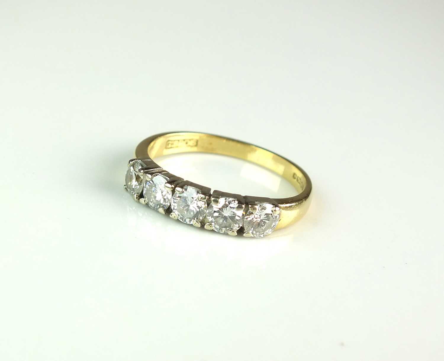 Lot 24 - An 18ct gold five stone diamond ring