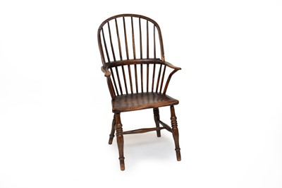 Lot 643 - A 19th century comb-back ash Windsor chair