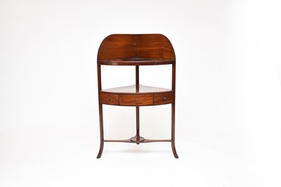 Lot 673 - A George III mahogany corner washstand