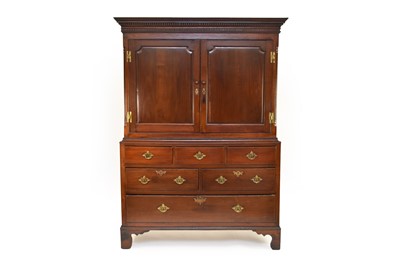 Lot 649 - A George III and later oak livery cupboard