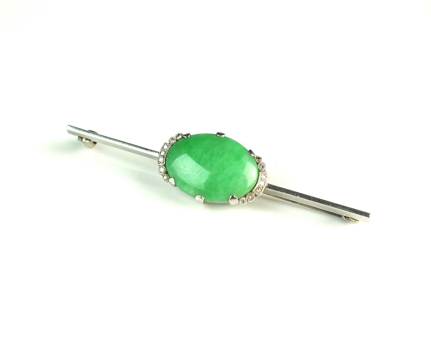 Lot 60 - A jade and diamond bar brooch