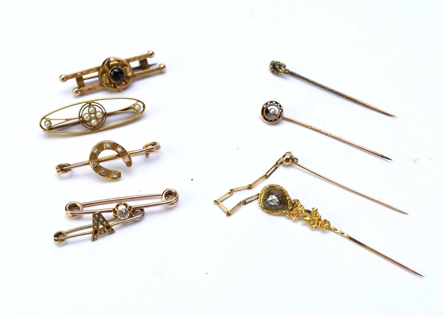 Lot 85 - A collection of five bar brooches and 3 stock pins