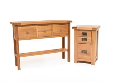 Lot 638 - A modern light oak hall table and a similar small cabinet