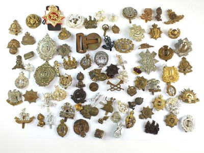 Lot 188 - A mixed collection of eighty military badges,...