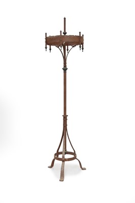 Lot 660 - A 19th century wrought iron and brass candle stand