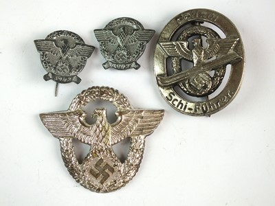 Lot 337 - Four German police badges