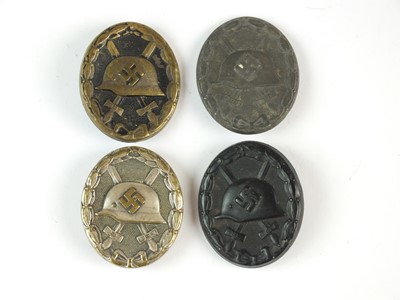 Lot 338 - Four German Second World War wound badges