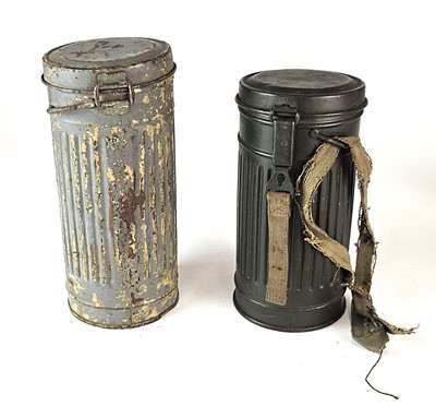 Lot 230 - Two German Third Reich gas mask respirator tins and a German civilian VM40 respirator