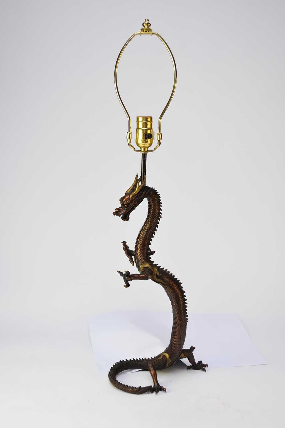 Lot 448 - A Chinese bronze dragon table lamp