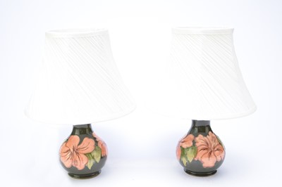Lot 359 - A pair of Moorcroft 'Green Hibiscus' table lamps