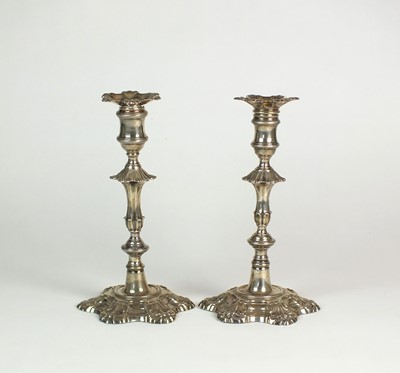 Lot 74 - A near pair of George II silver candlesticks