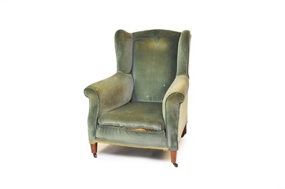 Lot 657 - An Edwardian wing armchair