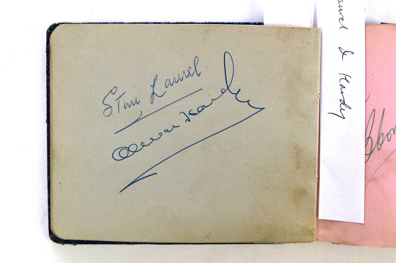 Lot 1107 - STAN LAUREL AND OLIVER HARDY autographs in an album.