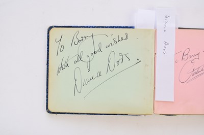Lot 1107 - STAN LAUREL AND OLIVER HARDY autographs in an album.