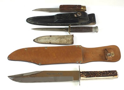 Lot 202 - A group of knives comprising Bowie knives, scout knife, Leopard knife