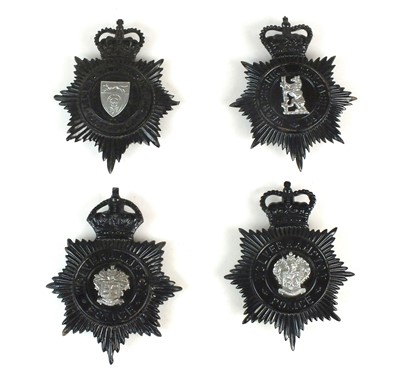 Lot 257 - Four Police black star helmet plates