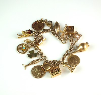 Lot 33 - A 9ct gold bracelet with attached 9ct gold and yellow metal charms