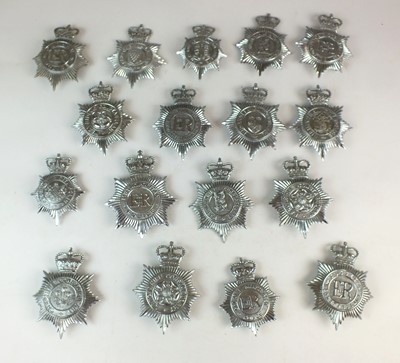 Lot 259 - Seventeen Queen's Crown Police helmet plates