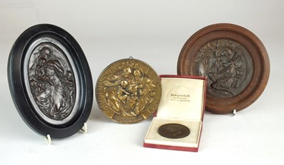 Lot 68 - Walter Gilbert (British, 1871-1946), three Bromsgrove Guild plaques and a medallion (4)