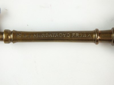 Lot 70 - Walter Gilbert (British, 1871-1946), a Bromsgrove Guild enamelled bronze presentation key