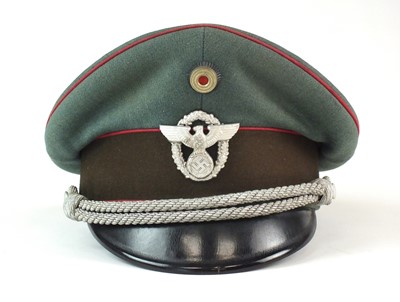 Lot 319 - A scarce German Third Reich Municipal Protection Police visor cap