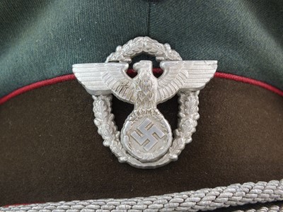 Lot 319 - A scarce German Third Reich Municipal Protection Police visor cap