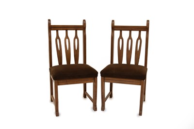Lot 621 - A set of four German or Austrian oak side chairs, inter-war period