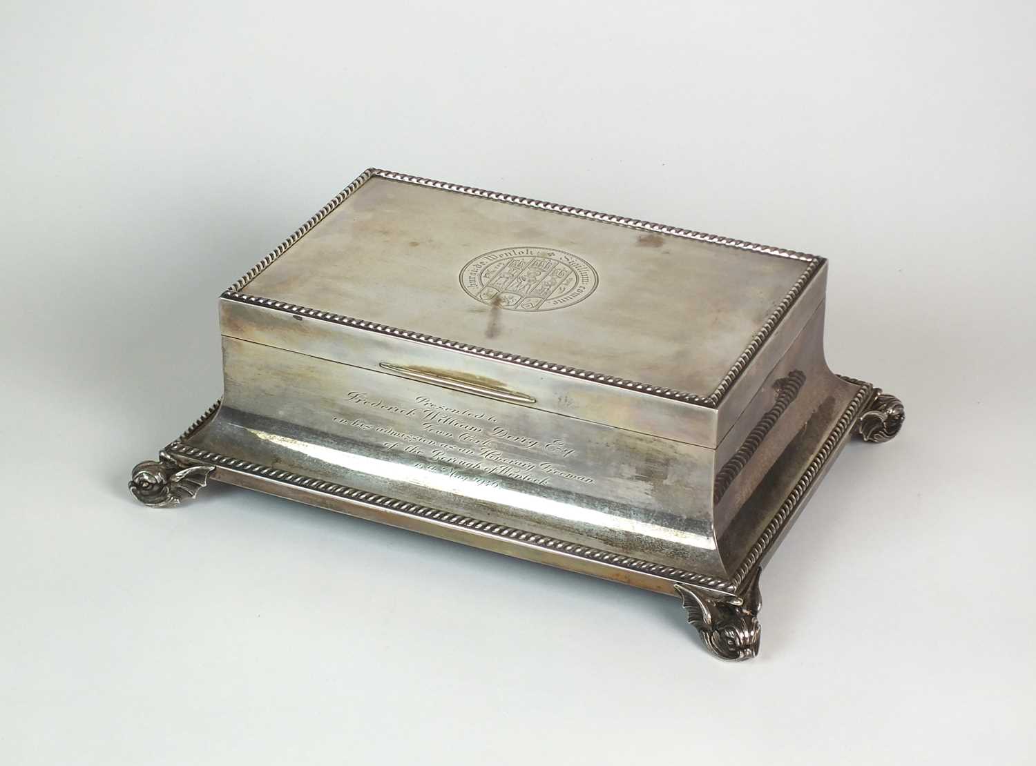 Lot 3 - A Goldsmiths & Silversmiths Co Ltd silver mounted presentation cigar box