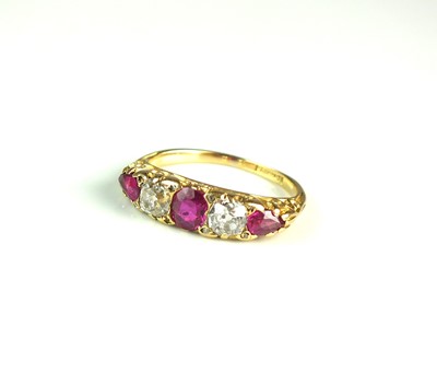 Lot 30 - A graduated five stone pink sapphire and diamond ring
