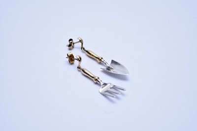 Lot 214 - A pair of 9ct yellow and white gold trowel and fork earrings