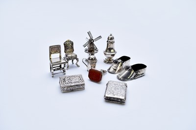 Lot 9 - A small collection of silver and white metal novelty wares