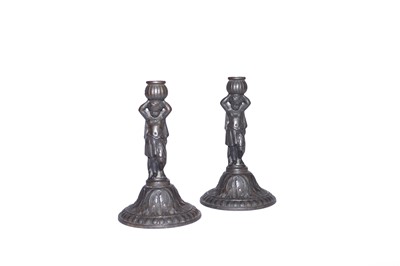Lot 538 - A pair of 19th century Coalbrookdale cast iron figural candlesticks, 19cm high