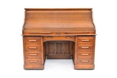 Lot 689 - A good 1930s oak tambour-top desk