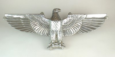 Lot 303 - A De-Nazified German cast aluminium wall eagle,...