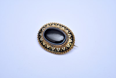 Lot 143 - A Victorian mourning locket brooch