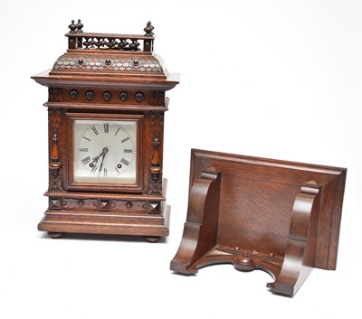 Lot 417 - A late 19th century, reformed Gothic style, bracket clock and bracket (2)