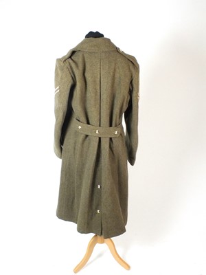Lot 48 - 1944 dated British Battledress Greatcoat and a German pottery helmet