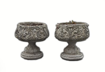 Lot 755 - A pair of cast stone garden urns