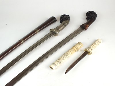 Lot 194 - Two Malayan Parang Short Swords and a Japanese bone tanto
